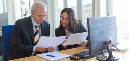 female-professional-explaining-document-details-client-workplace-serious-business-leader-consulting-financial-legal-expert-teamwork-cooperation-concept-1-scaled.webp