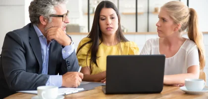 young-entrepreneurs-mature-investor-watching-presentation-discussing-project-1-scaled.webp